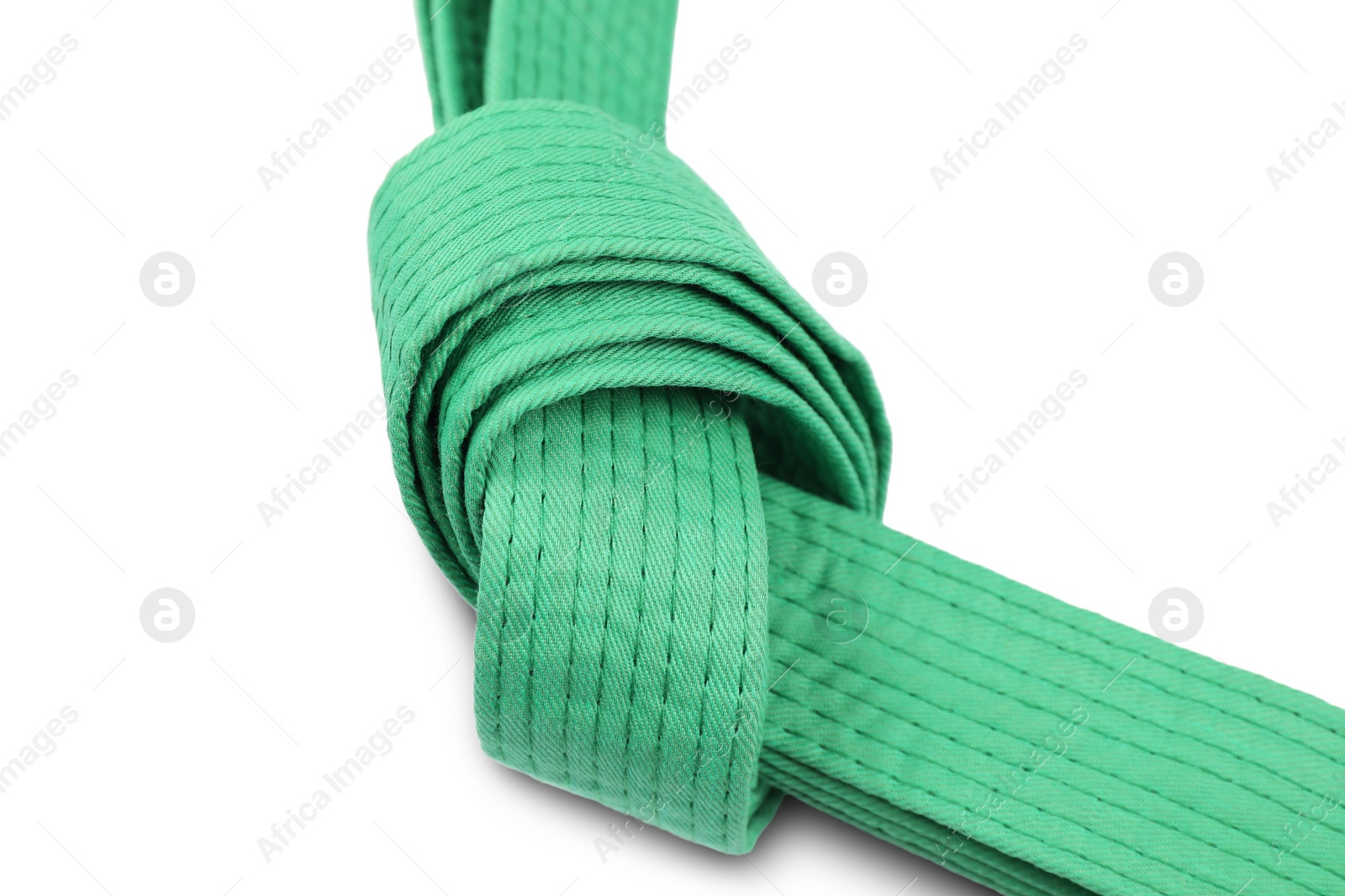 Photo of Green karate belt isolated on white. Martial arts uniform