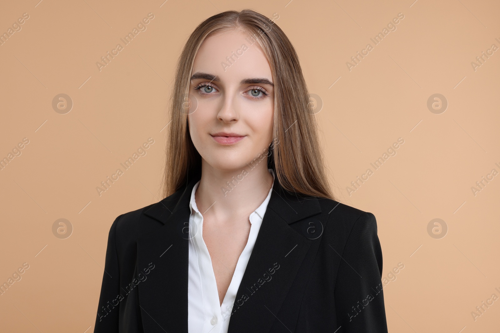 Photo of Portrait of young secretary on beige background