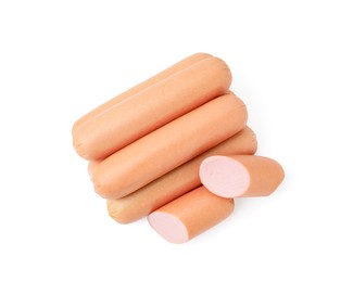 Photo of Whole and cut delicious boiled sausages on white background, top view