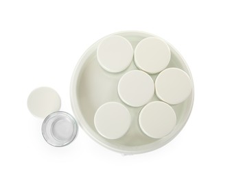 Modern yogurt maker with jars on white background, top view