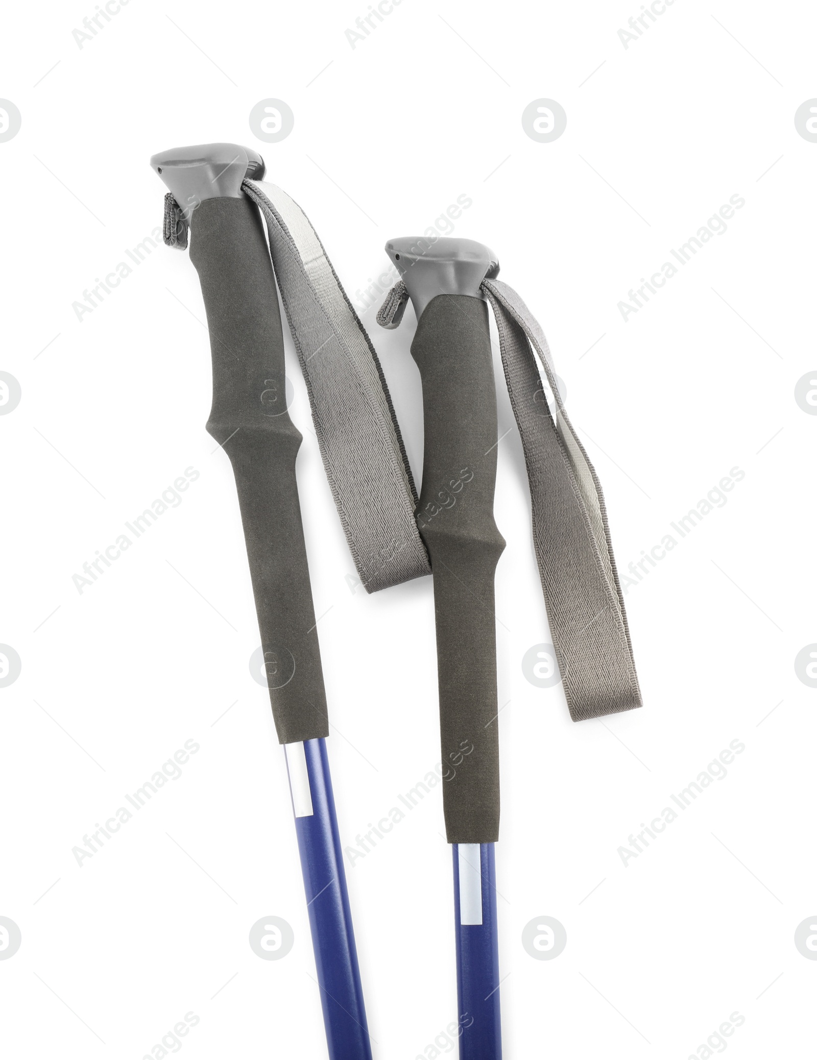 Photo of Pair of trekking poles on white background, top view. Camping tourism