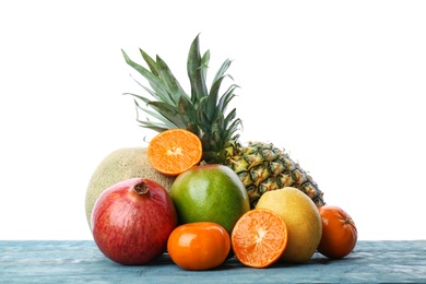 Photo of Set of fresh tropical fruits on wooden table