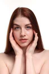 Portrait of beautiful woman with freckles on white background