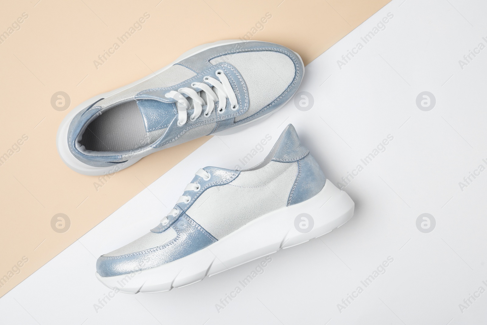 Photo of Stylish shoes on color background, flat lay