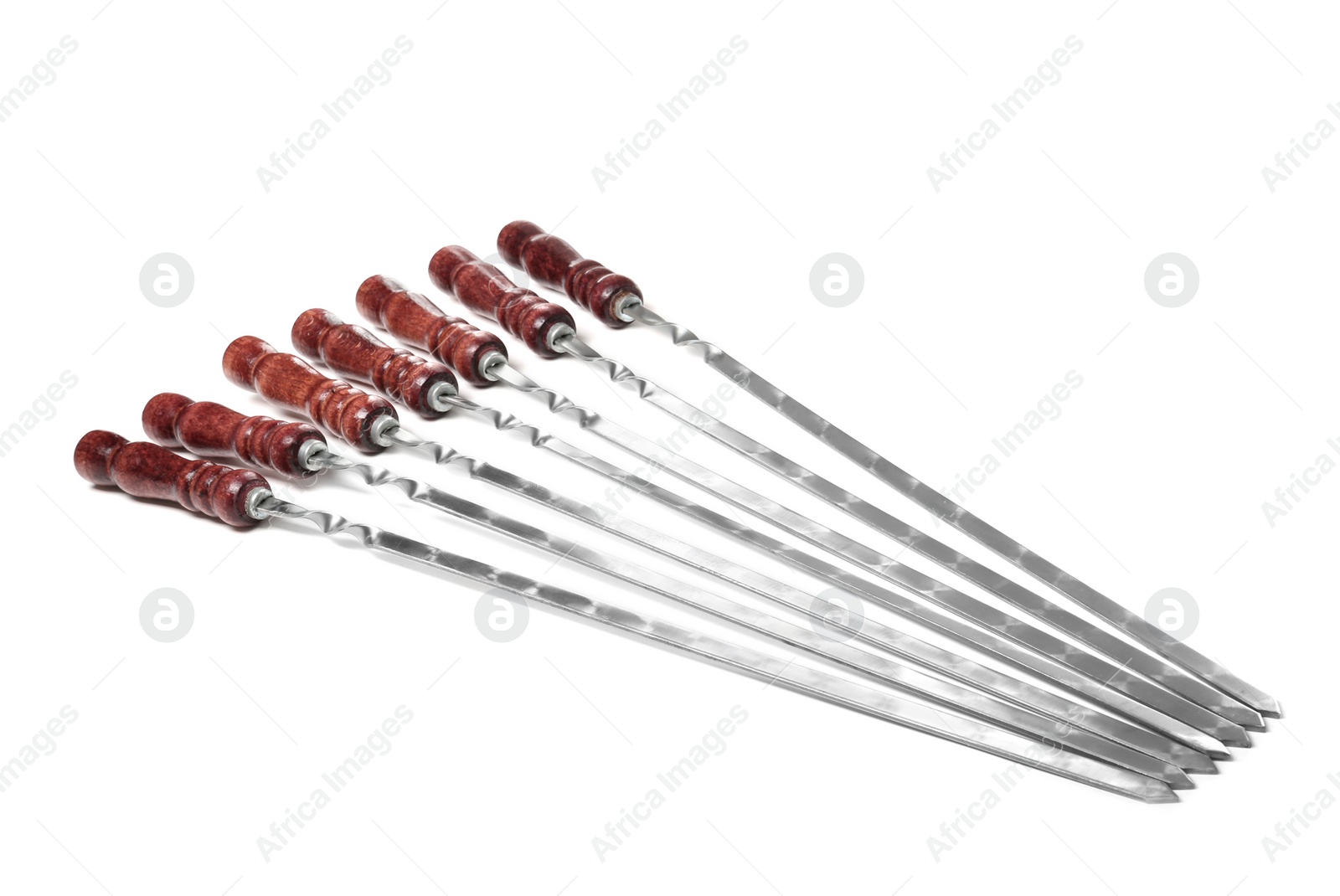 Photo of Metal skewers with wooden handle on white background