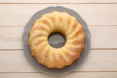 Photo of Delicious sponge cake on wooden table, top view