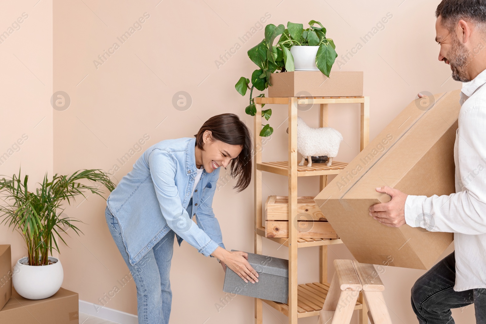 Photo of Happy couple in new apartment. Moving day