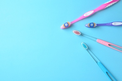 Flat lay composition with manual toothbrushes on color background