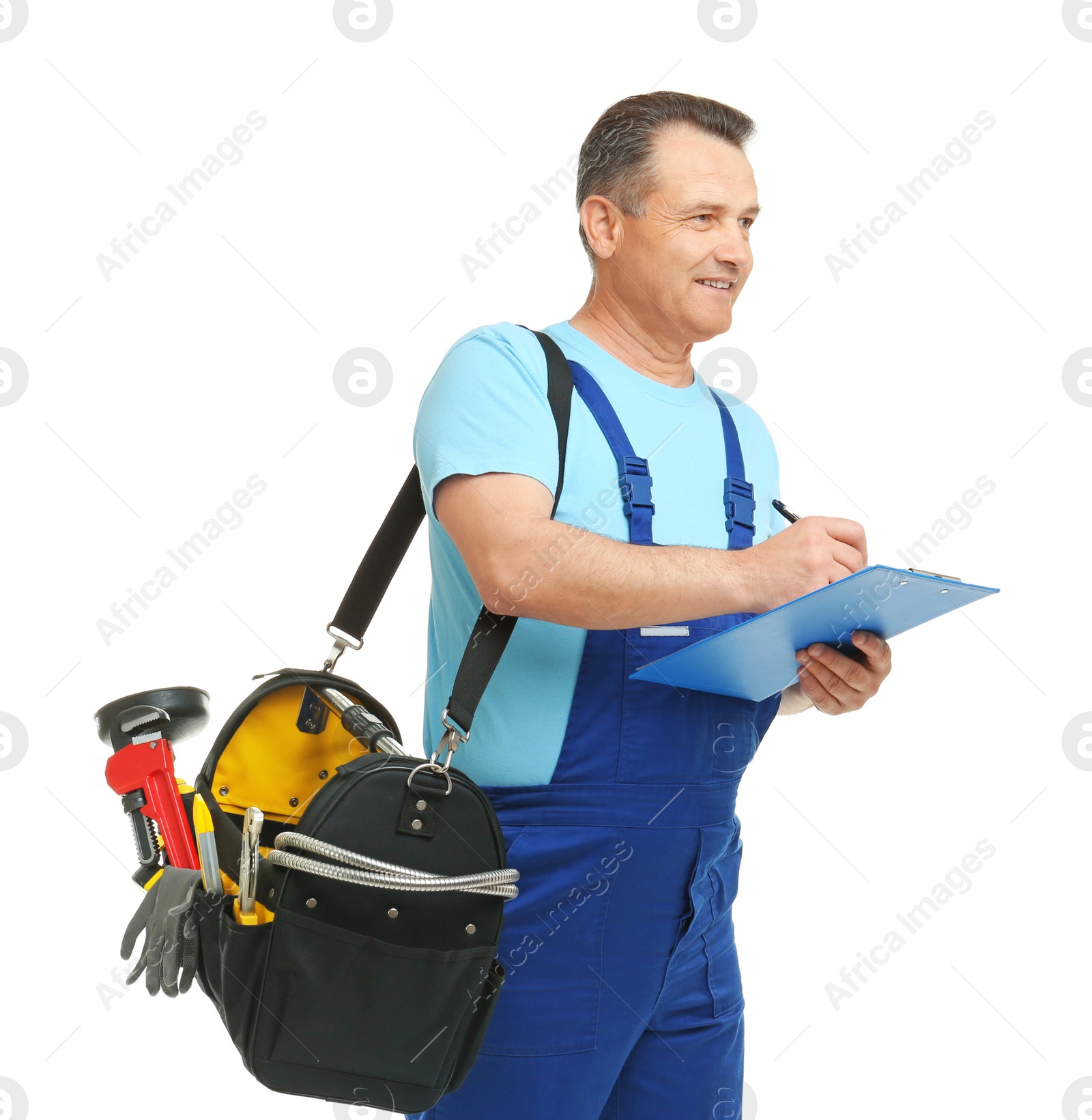 Photo of Mature plumber with clipboard and tool bag on white background