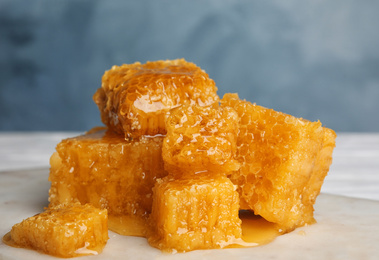 Fresh delicious honeycombs on white table, closeup