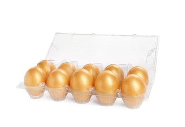 Photo of Many shiny golden eggs in plastic container on white background
