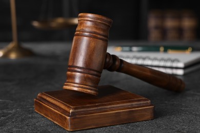 Photo of Law concept. Judge's gavel on grey textured table, closeup