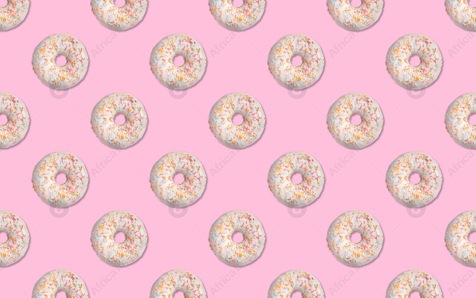 Image of Creative pattern design of glazed donuts on pink background