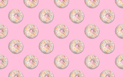 Image of Creative pattern design of glazed donuts on pink background