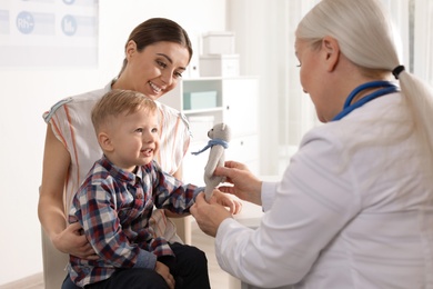 Mother with child visiting doctor in hospital