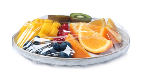 Photo of Tray of cut fruits wrapped with transparent plastic stretch film isolated on white