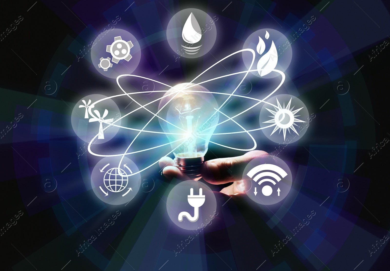 Image of Energy efficiency concept. Man holding light bulb surrounded by icons, closeup