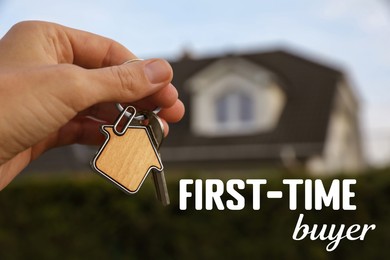 Image of First-time buyer. Woman holding house keys outdoors, closeup