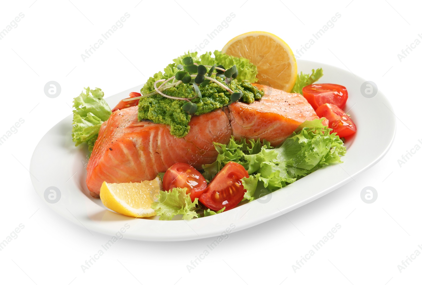 Photo of Tasty cooked salmon with pesto sauce and fresh salad on white background