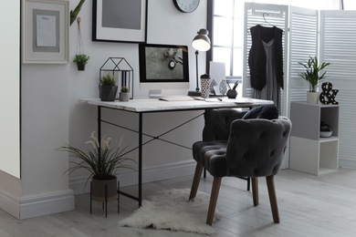 Photo of Stylish workplace with modern computer on desk