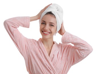 Photo of Beautiful young woman with hair wrapped in towel after washing on white background