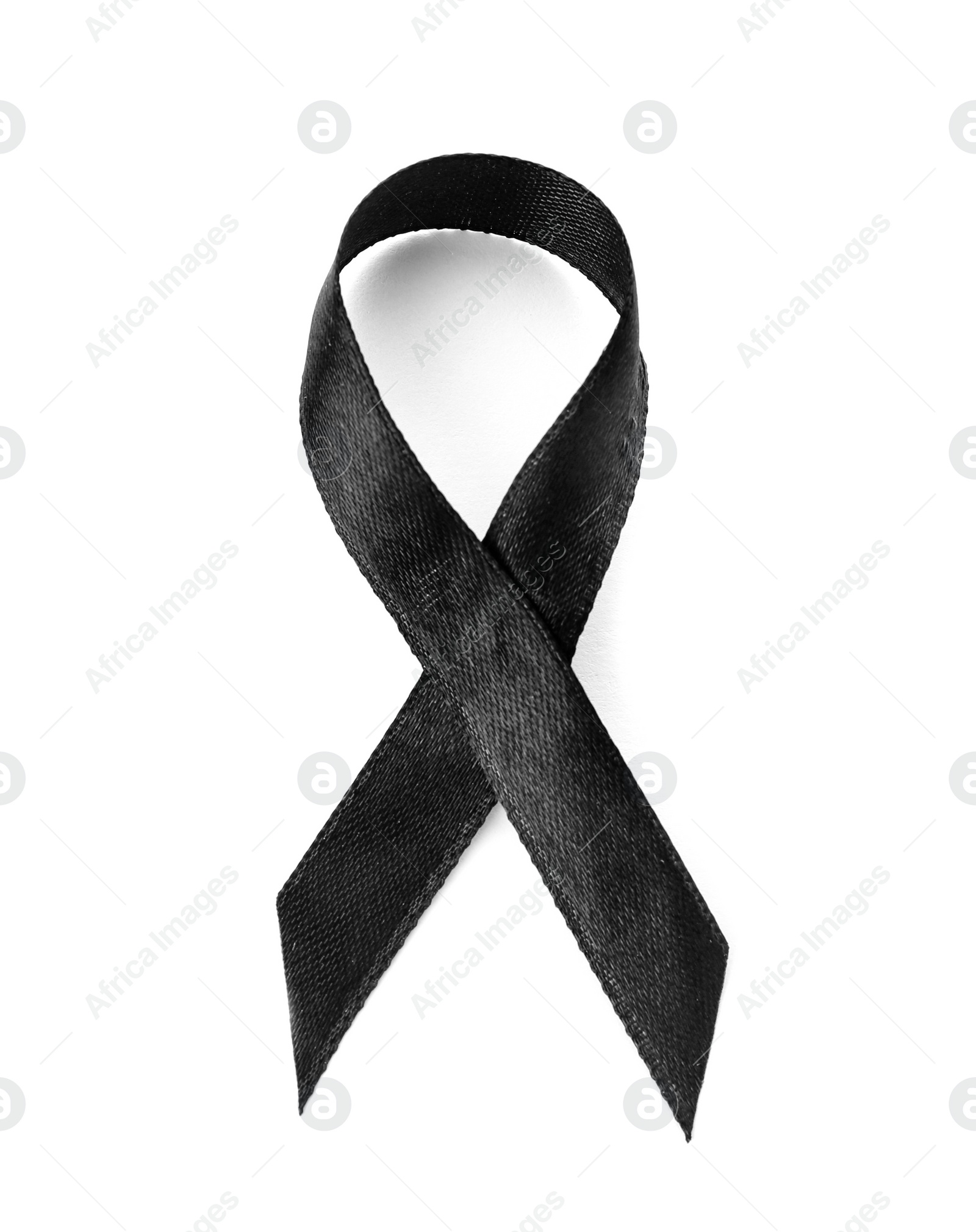 Photo of Black ribbon on white background. Funeral accessory