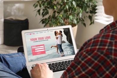 Image of Looking for partner. Man using laptop at home, closeup. Dating site webpage on device screen