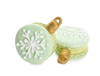 Photo of Beautifully decorated Christmas macarons on white background