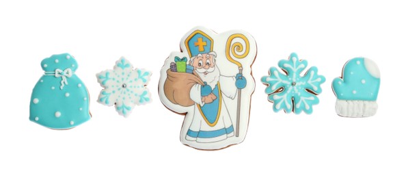 Tasty gingerbread cookies on white background, top view. St. Nicholas Day celebration