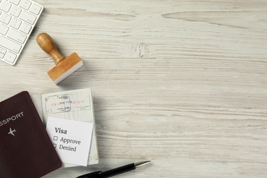 Moldova, Ceadir-Lunga - June 13, 2022: Flat lay composition with visa stamp, passports and pen on white wooden table. Space for text