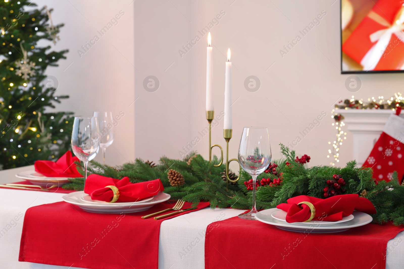 Photo of Beautiful table setting with Christmas decor in room