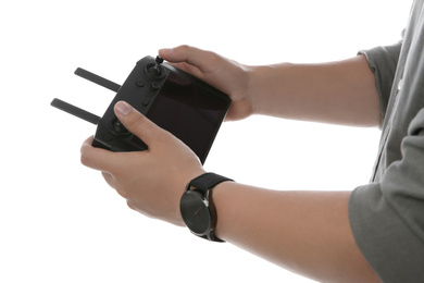 Man holding new modern drone controller on white background, closeup of hands