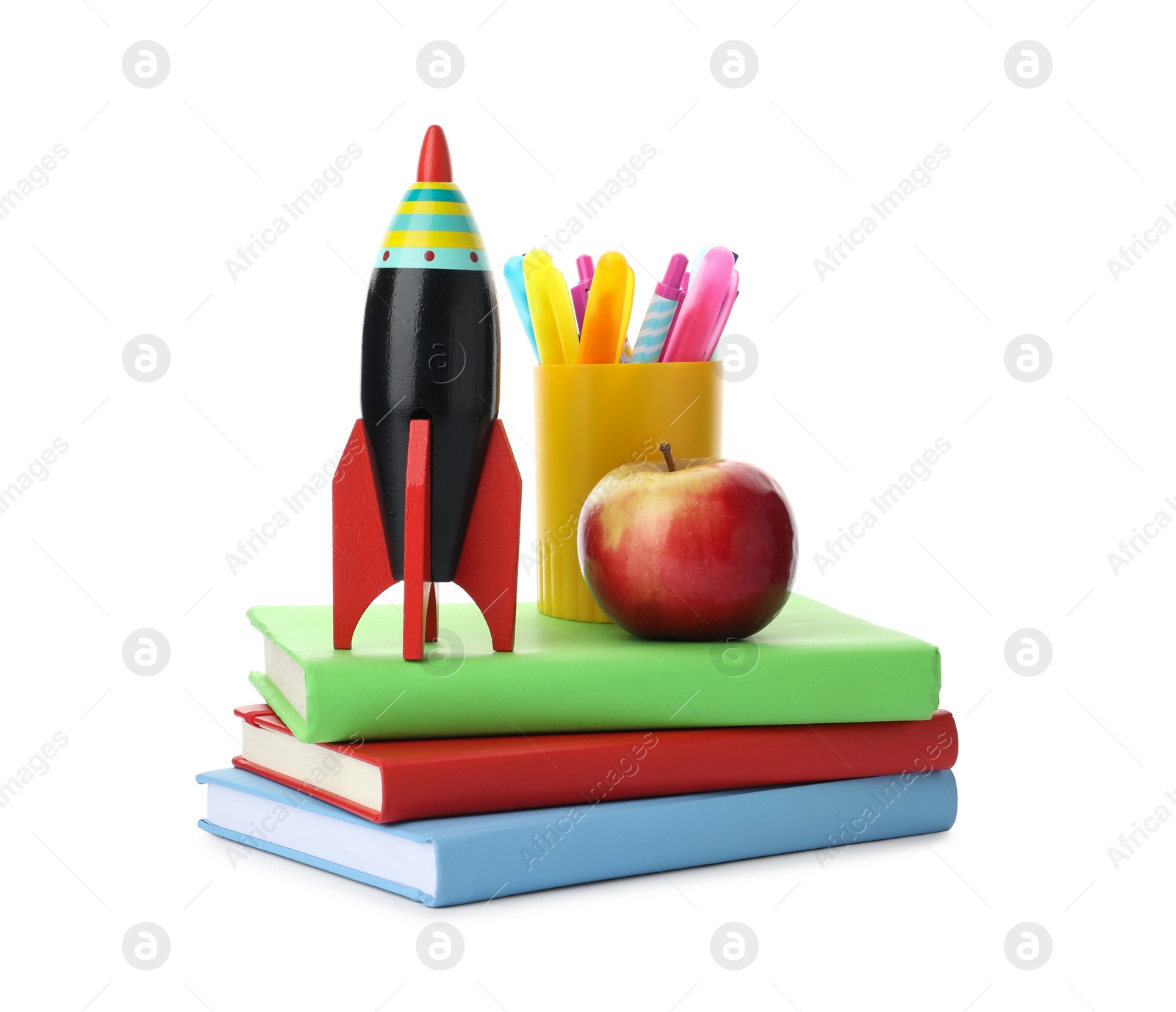 Photo of Bright toy rocket and school supplies on white background