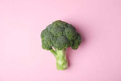 Photo of Fresh green broccoli on color background, top view. Organic food