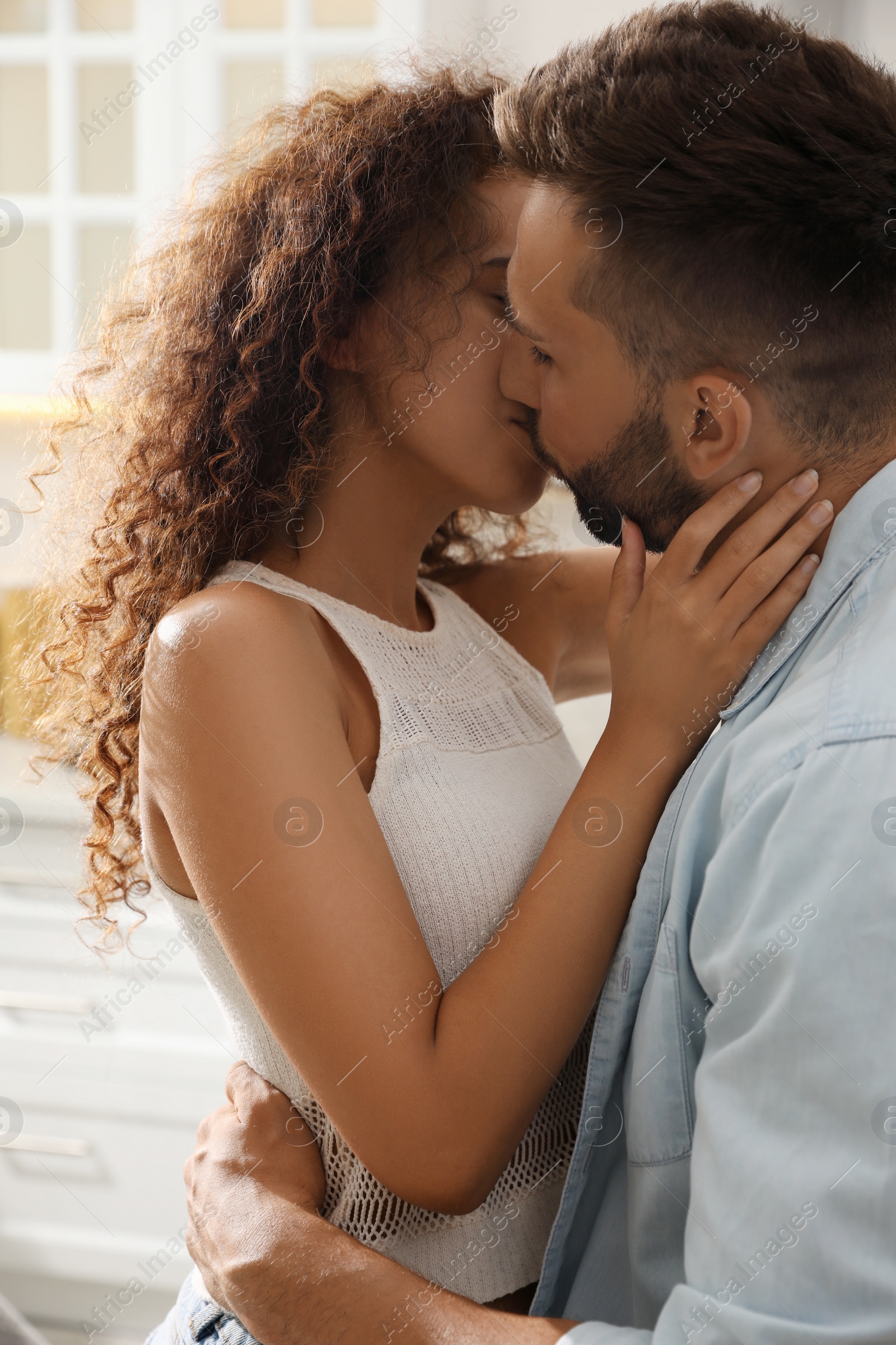 Photo of Lovely couple enjoying time together in kitchen