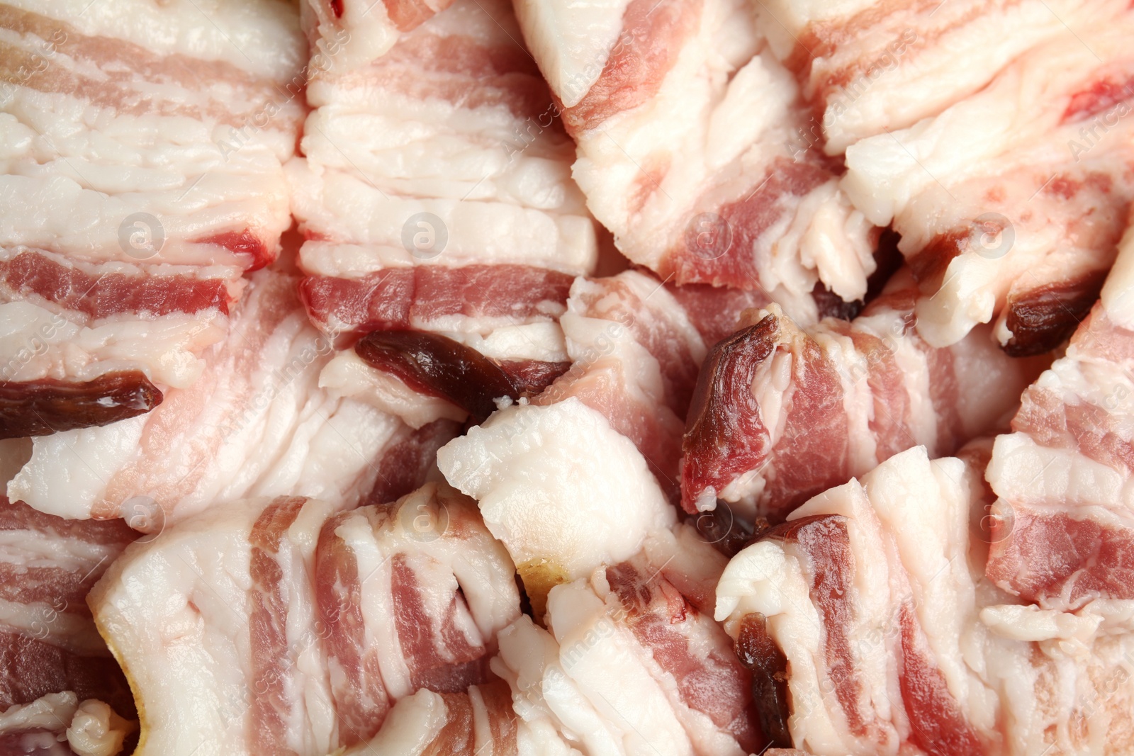 Photo of Slices of tasty bacon as background, closeup