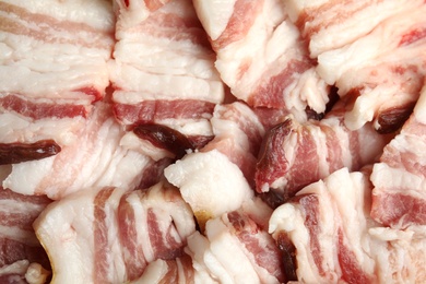 Photo of Slices of tasty bacon as background, closeup