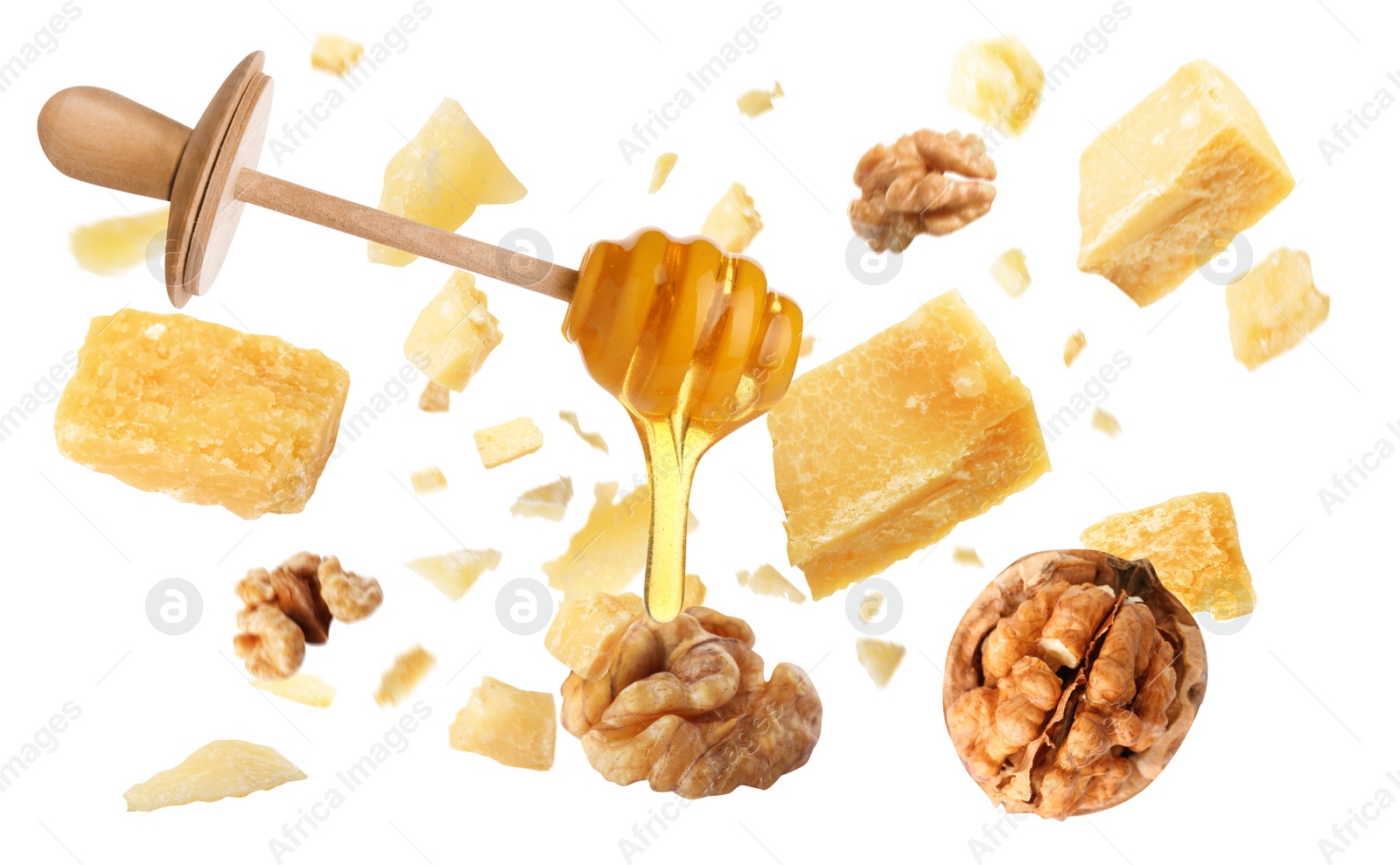 Image of Pieces of delicious parmesan, walnuts and honey falling on white background