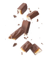 Image of Pieces of chocolate bars falling on white background