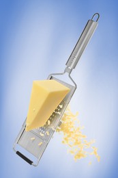 Image of Grating cheese with hand grater on blue background