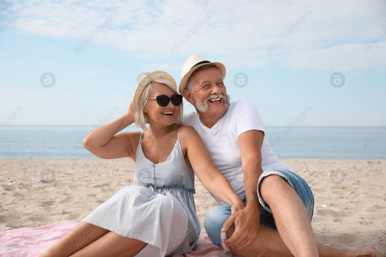 Photo of Mature couple spending time together on sea beach