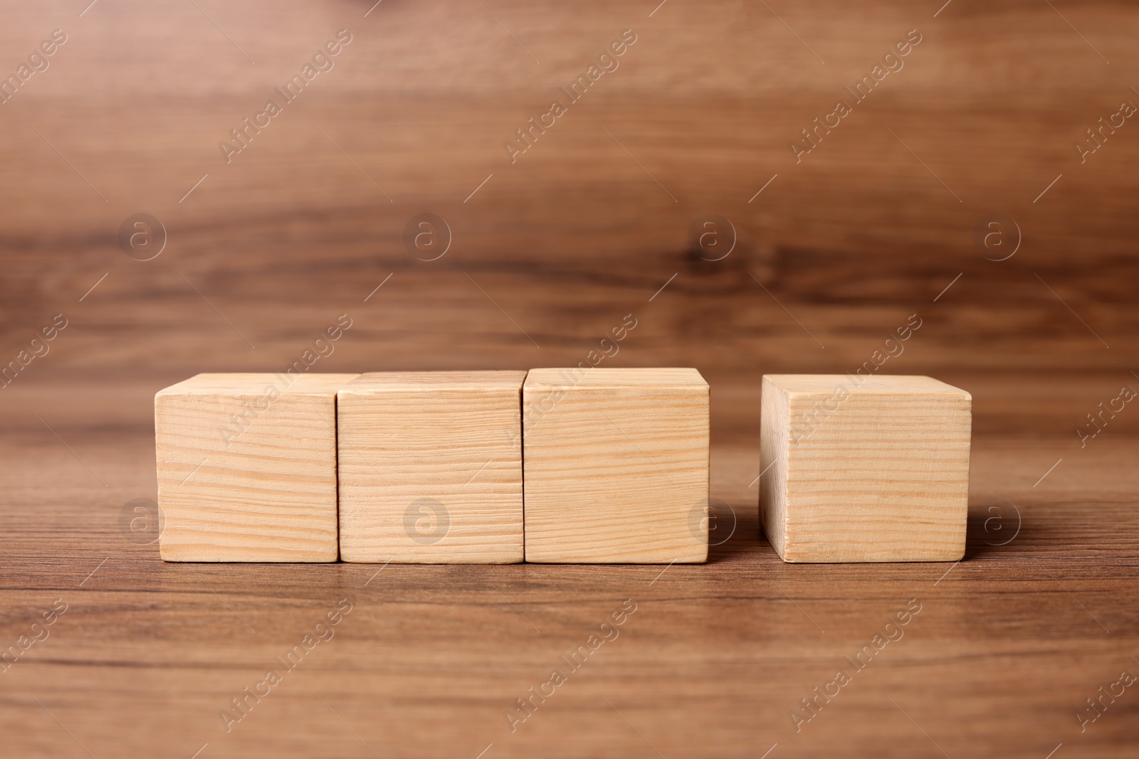 Photo of Cubes on wooden background, space for text. Idea concept