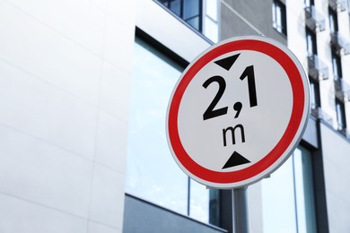 Photo of Traffic sign Height limit near modern building