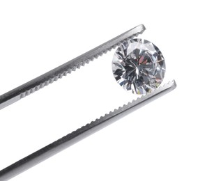 Photo of Tweezers with beautiful shiny diamond isolated on white