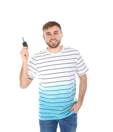 Happy young man with car key on white background. Getting driving license