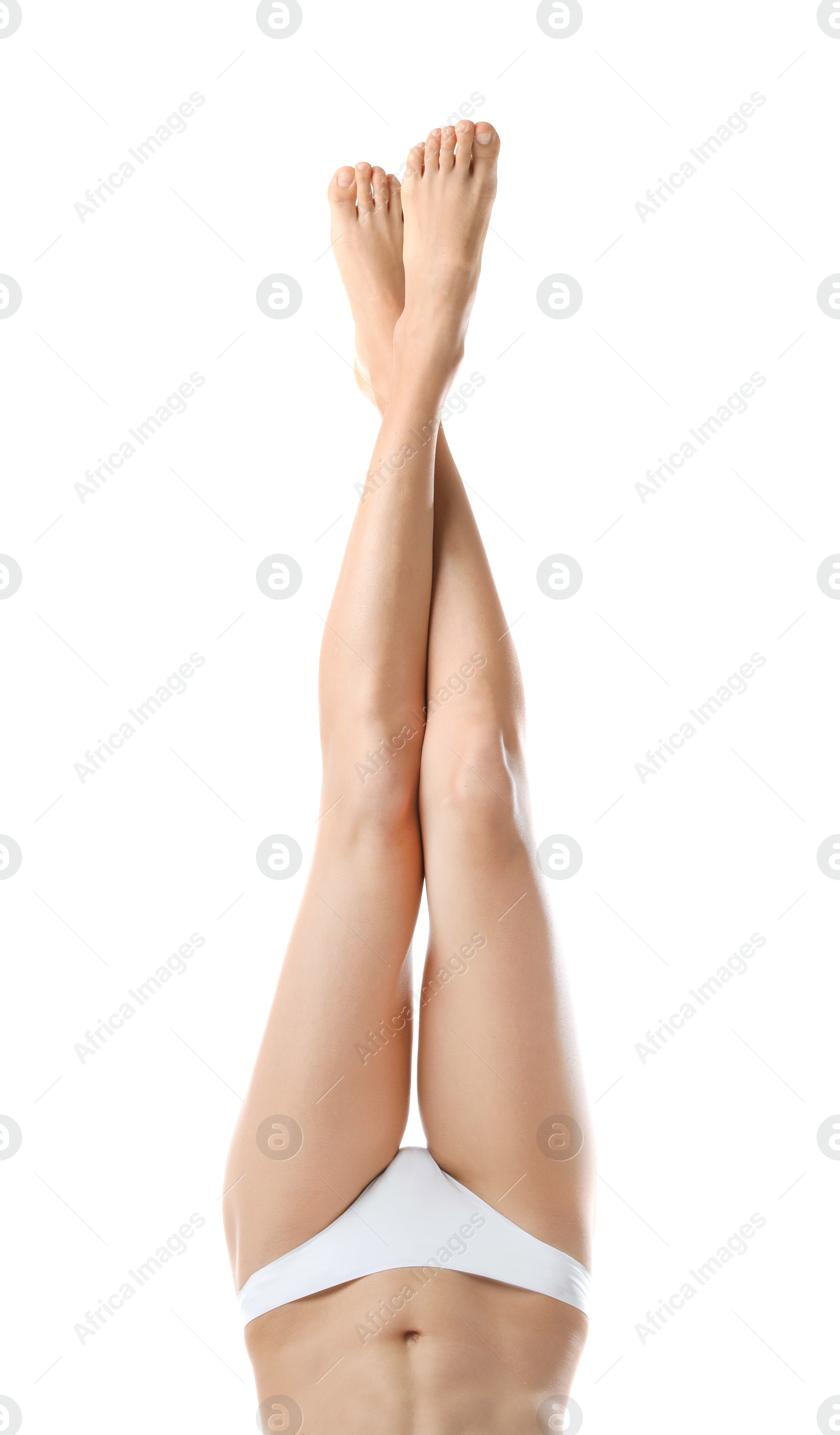 Photo of Young woman with beautiful long legs on white background, closeup