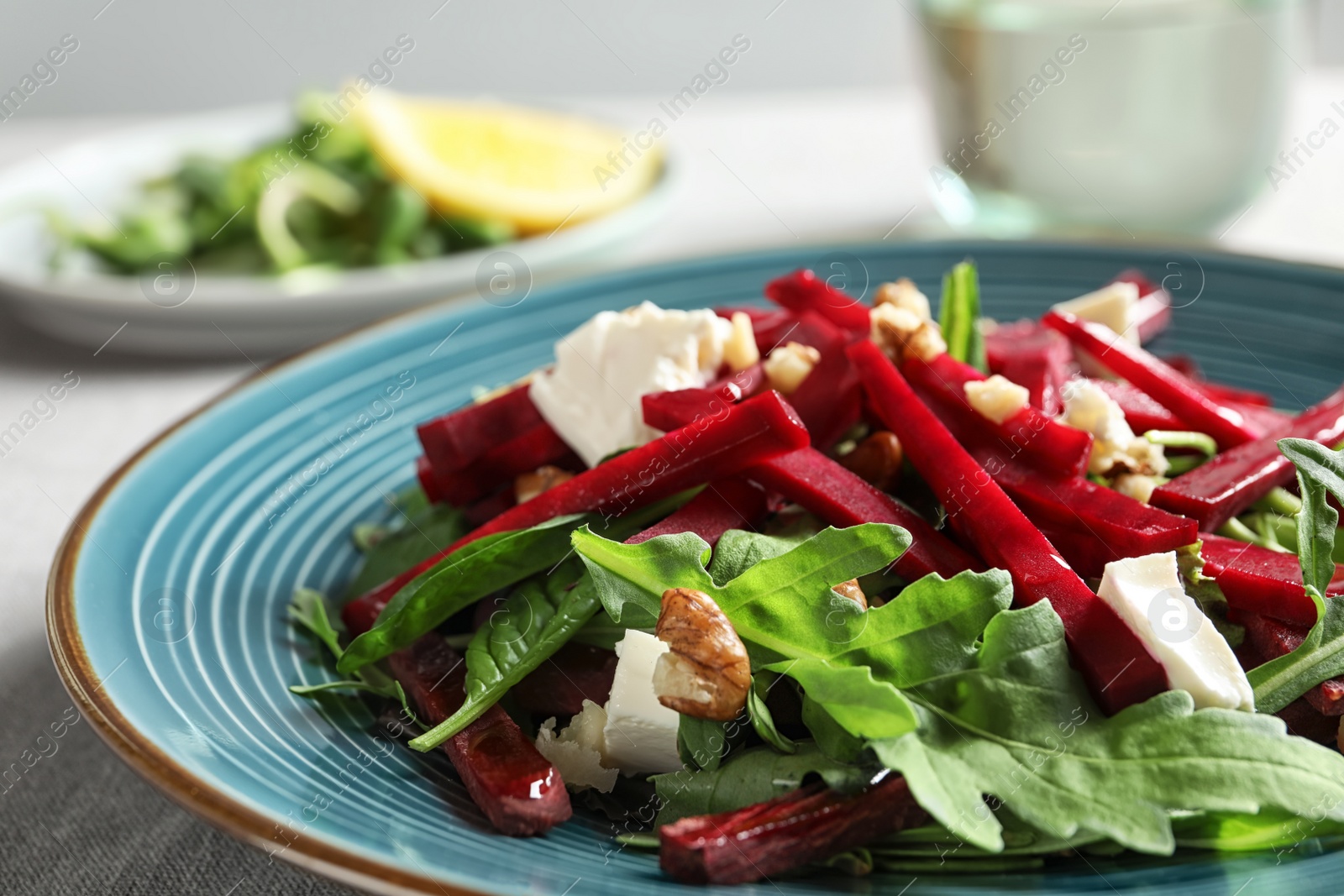 Photo of Plate with delicious beet salad on table, closeup