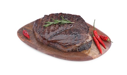 Photo of Wooden board with delicious fried beef meat, pepper and rosemary isolated on white, above view
