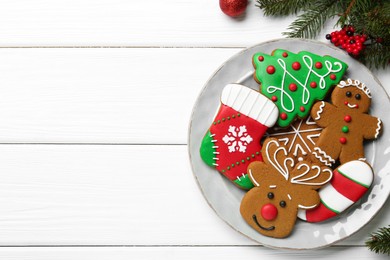 Photo of Tasty homemade Christmas cookies on white wooden table, top view. Space for text