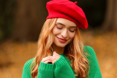 Portrait of beautiful woman wearing autumn sweater outdoors